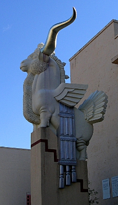 [Statue of a ram with extremely long horns.]